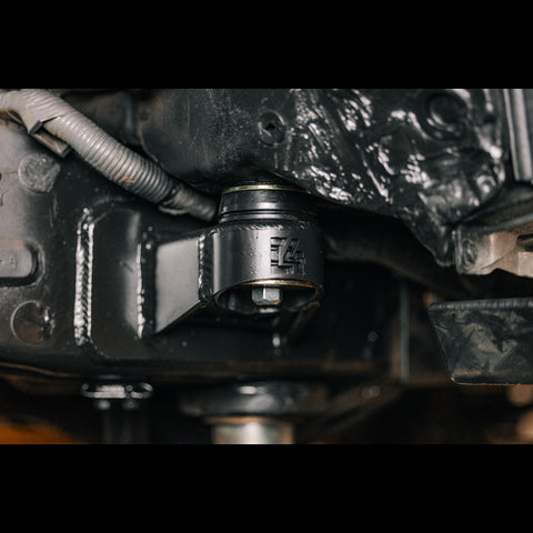 Close up view of the C4 Body Mount Relocation installed on a 3rd Gen Tacoma.
