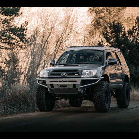 V8 4th Gen 4Runner on a dirt road and equipped with a C4 Hybrid front bumper.