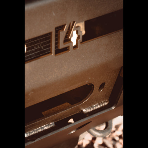 Close-up view of the C4 logo in the front of a Hybrid winch bumper.