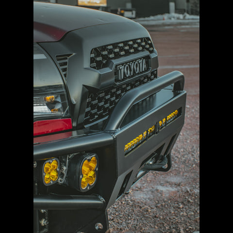 Close up quartering view of the front face of the C4 Hybrid front bumper and mid-height bull bar for the 2nd Gen Tacoma.