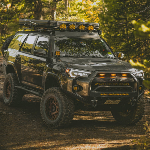 Quartering on view of a grey 4Runner with the C4 Lo-Pro bumper and its High Clearance Additions. 