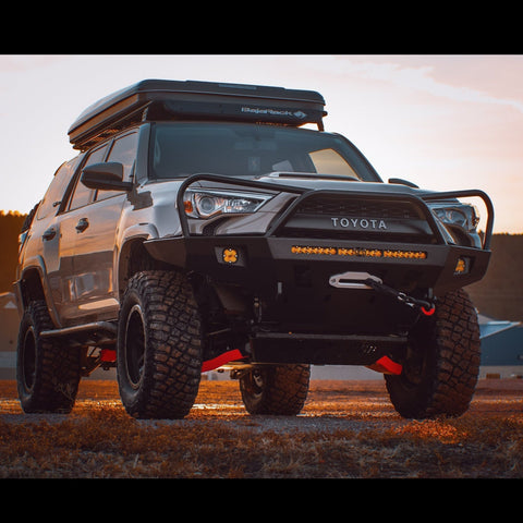 Grey 4Runner equipped with the C4 Overland winch bumper for the 5th Gen 4Runner with full-height bull bar and headlight hoops. 
