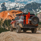 Maroon 4Runner at a mountain overlook with a rooftop tent, sliders and the Overland Rear Bumper with full-width single swing from C4 Fabrications.