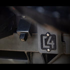 Close-up view of the C4 logo on the 4Runner rear bumper.