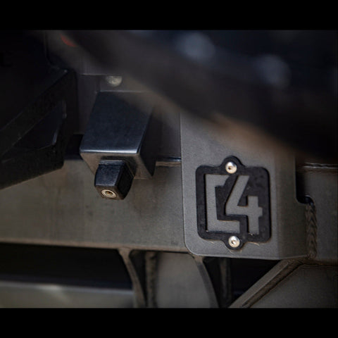Close-up view of the C4 logo on the 4Runner rear bumper.