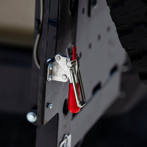 Close-up view of the adjustable-tension latch for the C4 dual swing rear bumper that helps tie the top of both swinging assemblies together. 