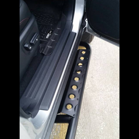 Open-door view of the front passenger side step on a set of C4 rock sliders for the 4Runner.