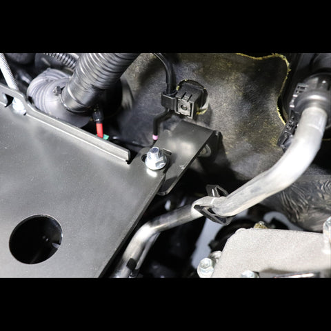 Close-up view showing the bracket with which the C4 Spare Battery Tray is secured to the firewall. 