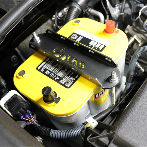 Close-up view showing the C4 Fabrication Spare Battery Tray for the 5th Gen 4Runner installed with an Optima battery in it.
