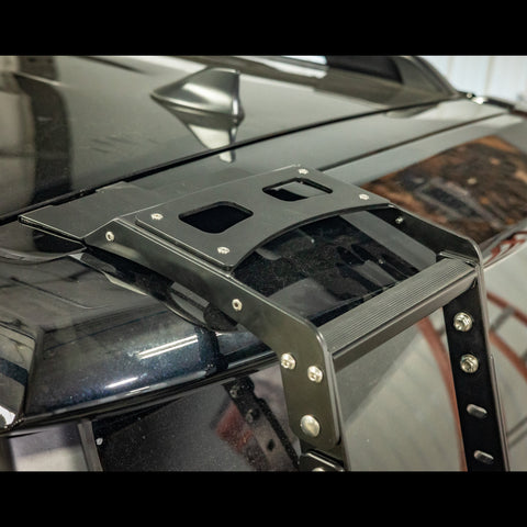 Close-up view of the top of the C4 Summit hatch ladder installed on a black 4Runner.