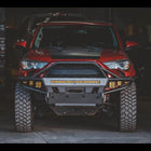 Shadowy photo of a 5th Gen 4Runner with a C4 Hybrid bumper with full-height bull bar and a full complement of aftermarket LED lighting.