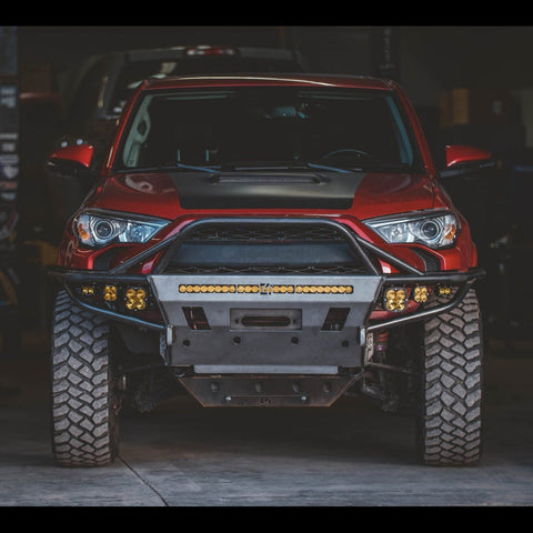 Shadowy photo of a 5th Gen 4Runner with a C4 Hybrid bumper with full-height bull bar and a full complement of aftermarket LED lighting.