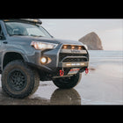 Grey 4Runner on the beach at the ocean, showing off a C4 Lo-Pro bumper with High Clearance Additions. 