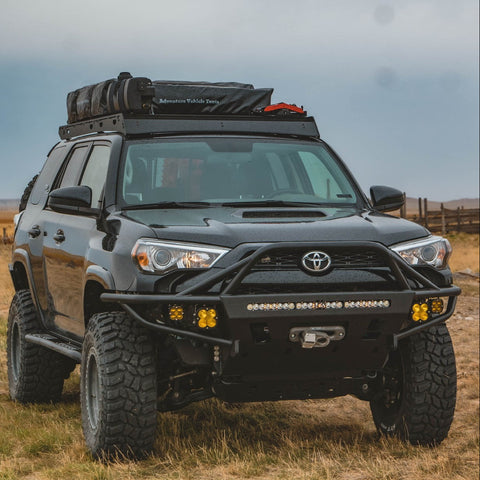 Black 2014 4Runner tastefully modified to include a C4 Hybrid front bumper with full-height bull bar and tube gussets. 