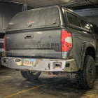 Second angle of the C4 Overland rear bumper for Toyota Tundras in bare steel finish before paint or powder coat. 