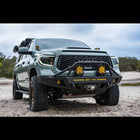 Late 2nd Generation Tundra parked on the beach with an Overland winch bumper installed.