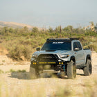 Blue Toyota Tacoma with C4 winch bumper.