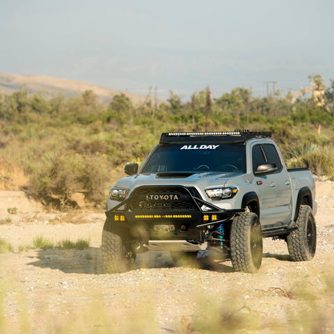 Blue Toyota Tacoma with C4 winch bumper.