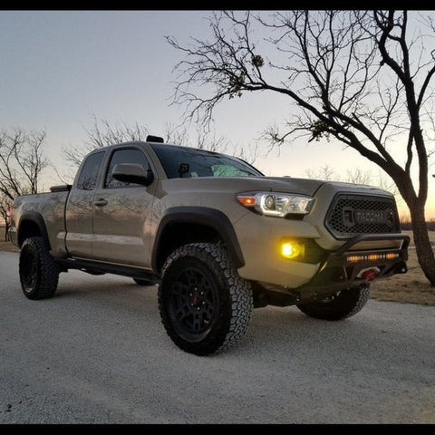 Tan extended cab Tacoma with a C4 Lo-Pro front bumper.