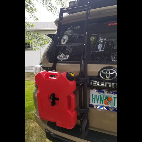 Quartering rear view of the C4 Summit hatch ladder equipped with accessories to include the C4 mount to accommodate a RotopaX pack mount and fuel container.