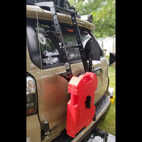 Quartering side view showing accessories mounted to the C4 Summit hatch ladder. 