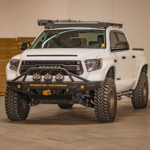 White 2014 Tundra with a C4 Fabrication Overland front winch bumper installed.