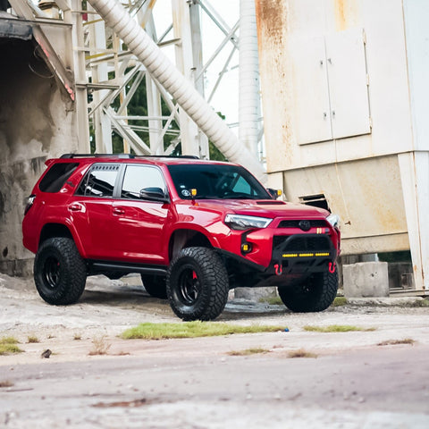 Red 5th Gen 4Runner showing the combination of the C4 High Clearance Additions used with extended and flared fiberglass fenders. 