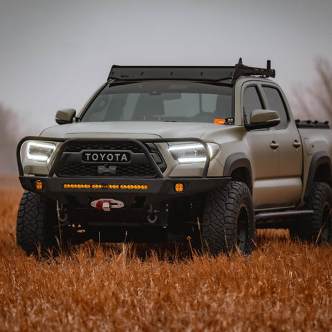 Tan Tacoma with C4 winch bumper.