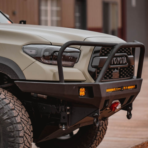 Quartering side view of the C4 Overland bumper with full-height bull bar and headlight hoops.
