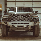 Tacoma with raw steel C4 Overland bumper.