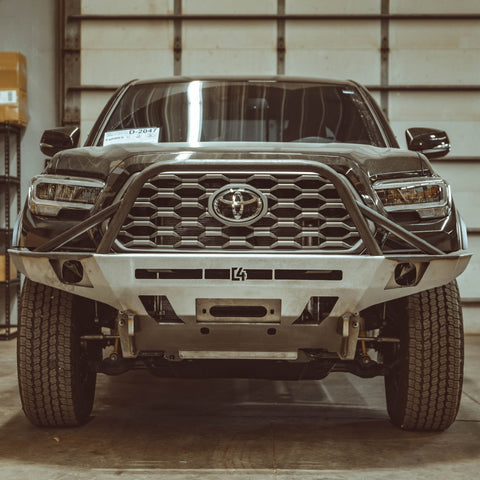 Tacoma with raw steel C4 Overland bumper.