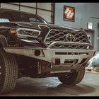 C4 Overland front winch bumper for the 3rd Gen Tacoma in raw steel.
