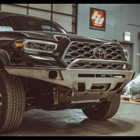 C4 Overland front winch bumper for the 3rd Gen Tacoma in raw steel.