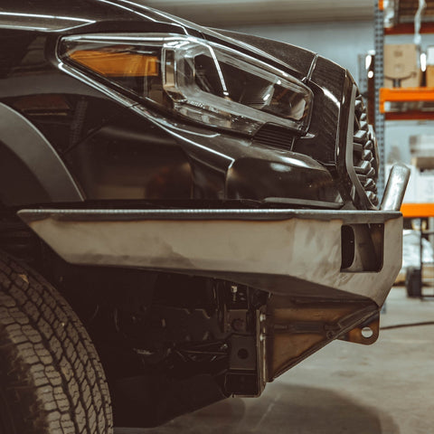 Close-up side view of the C4 Overland front bumper with mid-height bull bar showing how tight the bull bar fits to the grille.