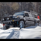 Tacoma in the snow and equipped for adventure.