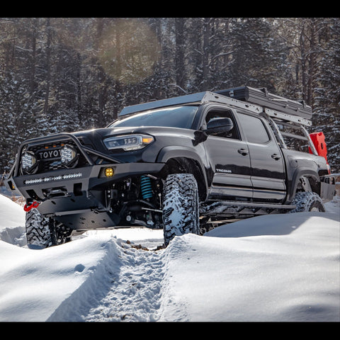 Tacoma in the snow and equipped for adventure.