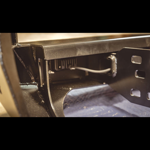 View in the rear structure of the C4 Overland rear bumper showing how the wiring for rear auxiliary lighting can be run as well as the construction of the inner bracing. 