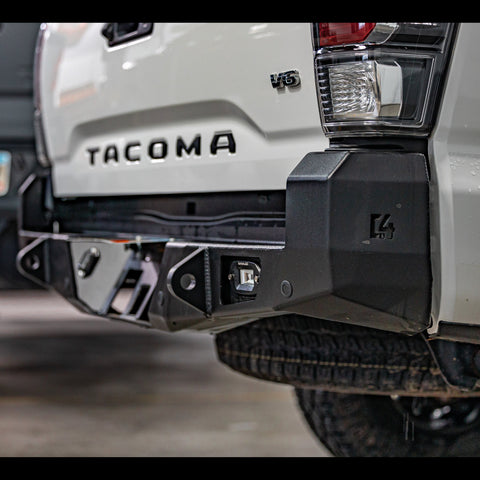 Passenger side view showing off the tow points, light mounts and steel end cap structure on the C4 Tacoma Overland rear bumper.