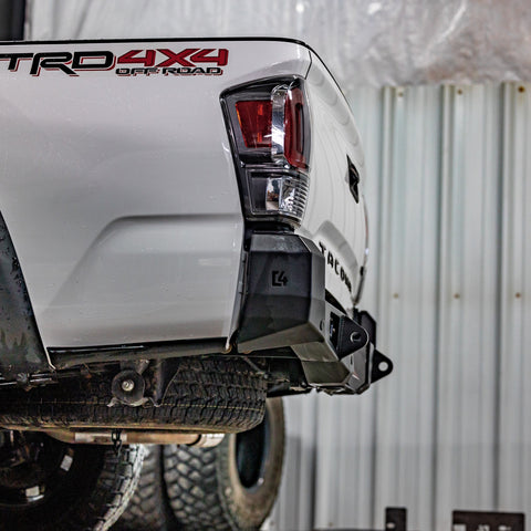 Low angle view showing the tow points and steel structure of the C4 Overland rear bumper for 3rd Gen Tacomas. 