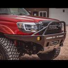 Front quartering view of the C4 Overland front winch bumper with full-height bull bar and tube gussets. 