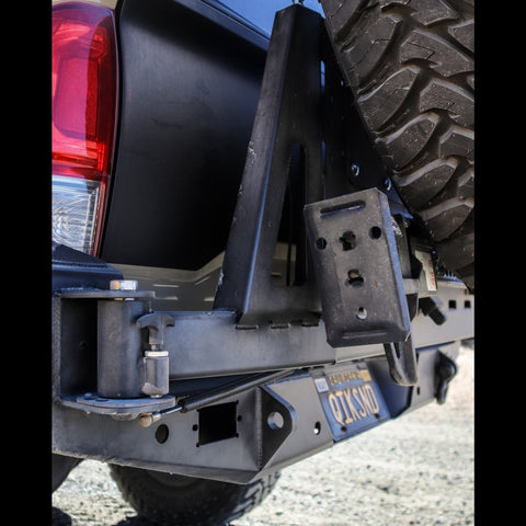 Close-up view of the hinge on the C4 rear bumper spare tire swing-out. 