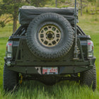 Rear view of the C4 swing-out high clearance bumper with spare tire carrier.