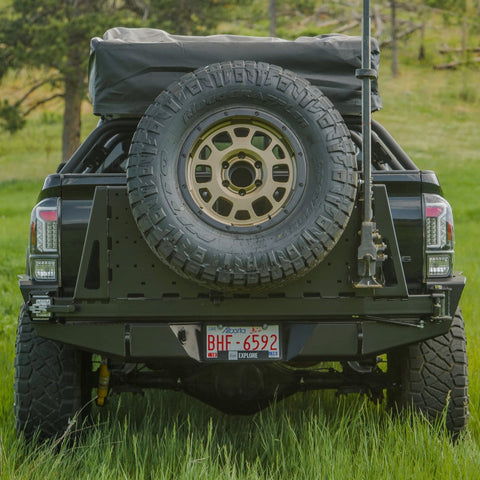Rear view of the C4 swing-out high clearance bumper with spare tire carrier.
