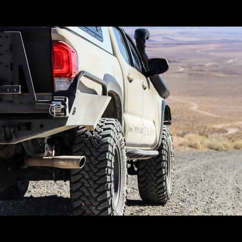 Rear side shot showing the incredible amount of clearance and departure angle gained with the C4 High Clearance Rear Bumper for the Toyota Tacoma.