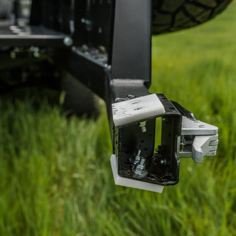 Close-up view of the delrin pads and high-strength latch used to secure the C4 swing out arm to the bumper and eliminate rattles.