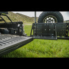 Wider view showing the fold-down table on the C4 swing-out bumper and how it corresponds to the height of the tailgate when folded down.