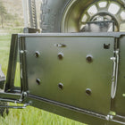 View of the integrated table folded up and stowed on the C4 rear swing-out. 