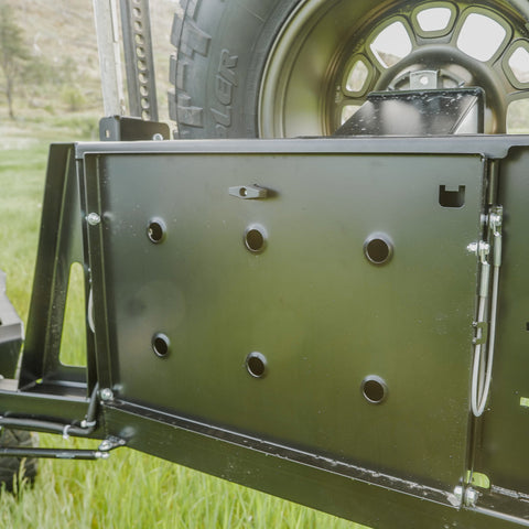 View of the integrated table folded up and stowed on the C4 rear swing-out. 