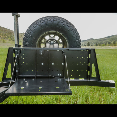 View of the inside of the C4 rear bumper swing out with the integrated table deployed. 