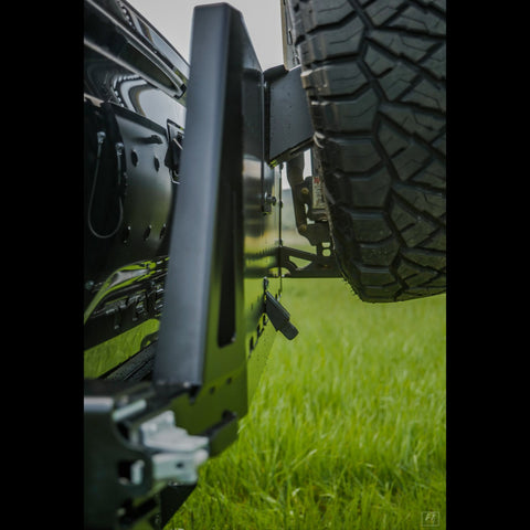 Close-up view showing how tight the swing-out arm sits to the tailgate on the C4 Overland High Clearance rear bumper.